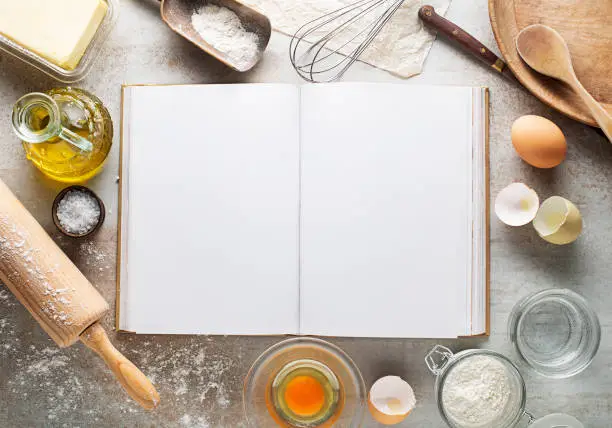 Photo of Baking and Cooking Ingredients and blank recipe book