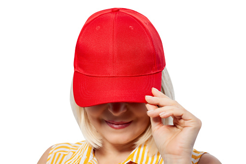 Blank red baseball cap mockup template, wear on women head, isolated, clipping path closeup. Woman in clear hat and t shirt mock up holding visor of caps. Cotton basebal cap mokcup on delivery guy.