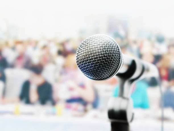 istock Dynamic microphone waits for public speaker at a business conference or seminar 1304881944