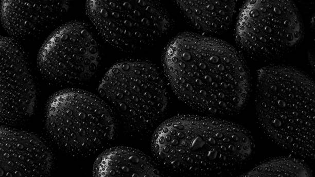 istock Black Stones.rock background and water drop 1304883622