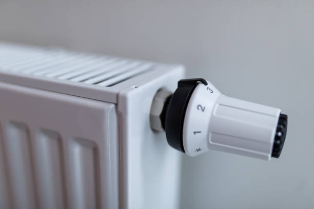 istock Heating white radiator radiator in living room. Heating. 1304884649