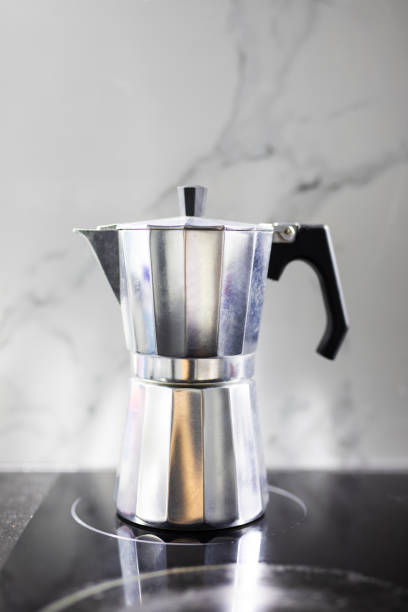 istock Teapot for coffee with coffee beans. Geyser coffee maker in the kitchen. 1304884879