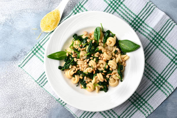 istock Funghetti pasta with spinach, pine nuts and parmesan. 1304886015