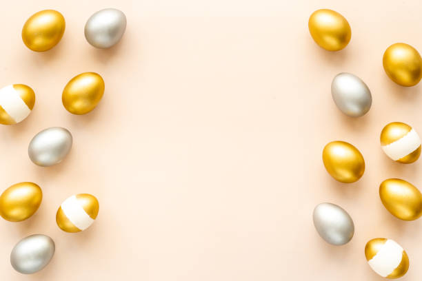 istock Flat lay of golden and silver eggs. Good luck symbol. Easter decoration 1304889297