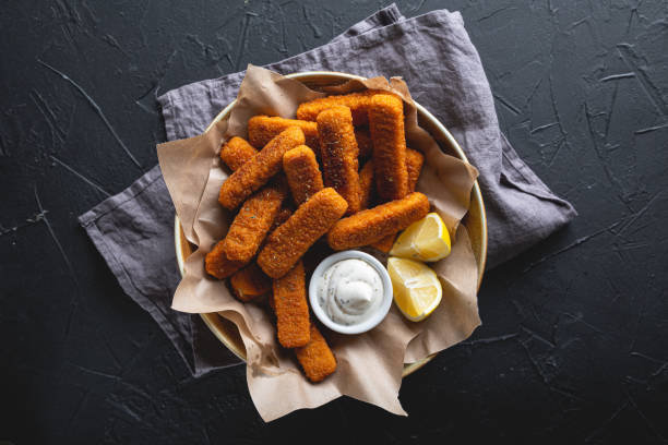 Fish sticks with sauce on the table Fish sticks with sauce on the table fish stick stock pictures, royalty-free photos & images