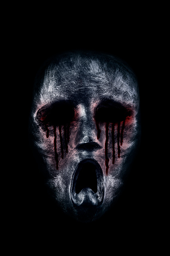 Creepy bloody ghost head isolated on black background