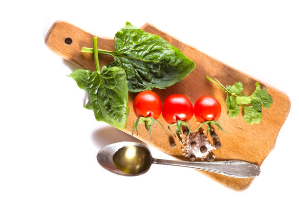 Vegetarian Mediterranean breakfast made of cherry tomatoes with different herbs and spices with olive oil.