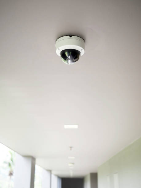 istock CCTV camera on white ceiling at walkway on ground floors. 1304899534