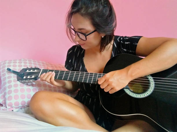 istock Girl playing the guitar 1304899535