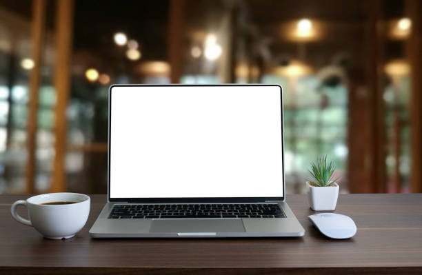 istock Front view of open laptop computer notebook with blank monitor white screen display on work table desk. Workspace office modern for job business online communication technology in shop or home indoor. 1304900723