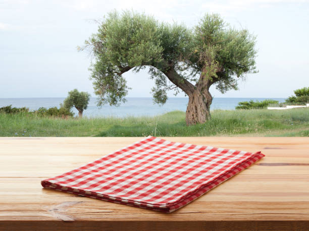 istock Empty napkin on wooden desk. Summer background. 1304900786