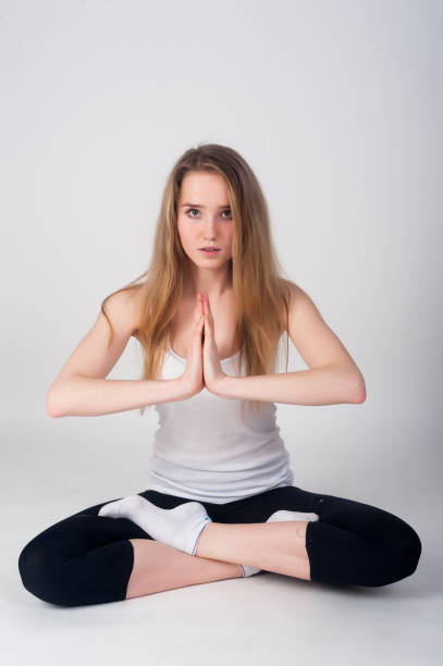 istock Pretty girl doing meditation exercise 1304901087