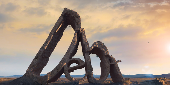 A conceptual image of a massive rock formation in the shape of the word 'Debt' - a debt mountain. The rocks are is the middle of a barren flat landscape and two climbers are traversing the rocks are sunset or sunrise under a colourful sky.
