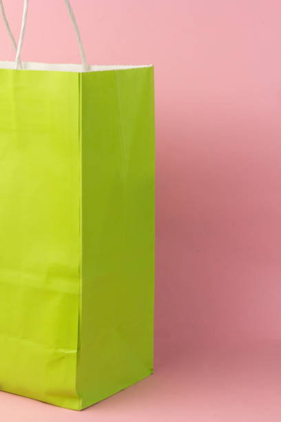 istock Bright gift bag isolated on pink background 1304905482