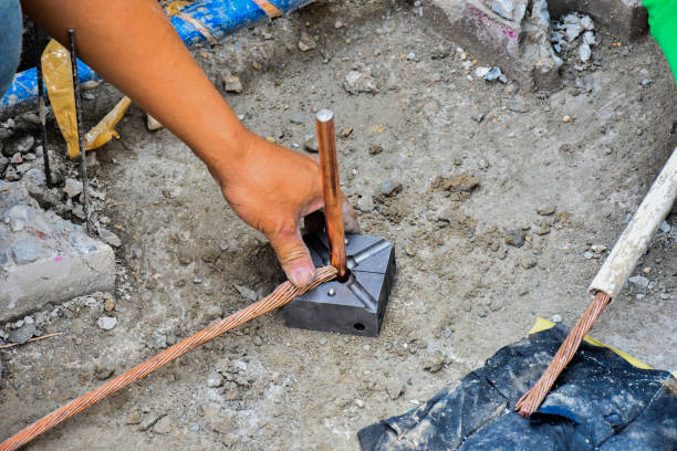 istock Workers working on protective earth system, used in construction of tall buildings. 1304906148