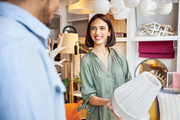 istock Young salesman assisting customer at deco store 1304906174