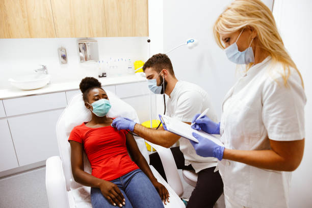 istock Doctor examines a sick patient with a stethoscope 1304909159