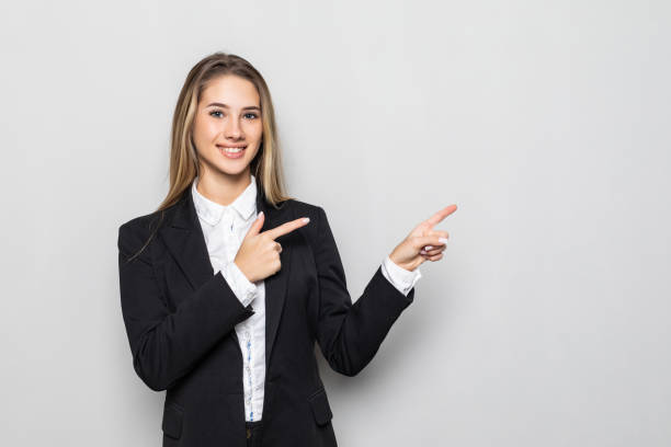 istock Business woman holding or presenting something isolated on white background 1304909612