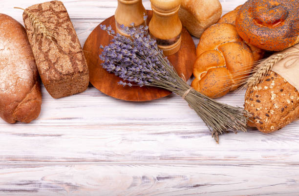 istock Rural breakfast with fresh bread. Fresh homemade Italian bread. 1304911041