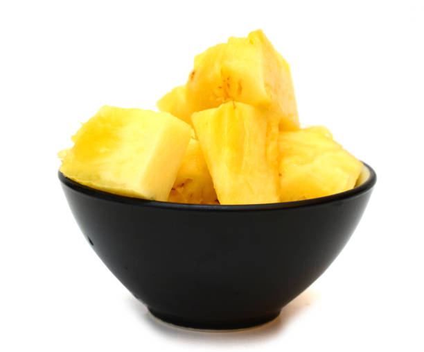 istock A full cubed slice pineapple bowl on white 1304912369
