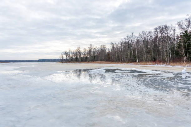 istock Frozen Lake in February in Latvia with Cloudscape 1304913229