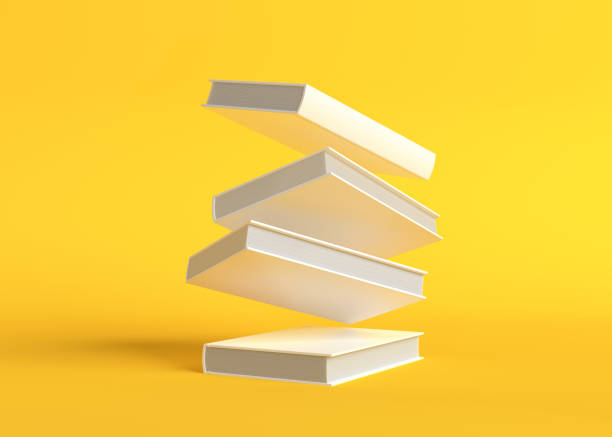istock Flying books on pastel yellow background 1304915212