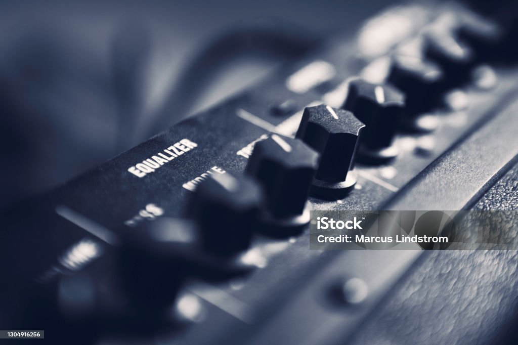 Guitar amplifier Toned close up photo of an electric guitar amplifier. Bass Guitar Stock Photo