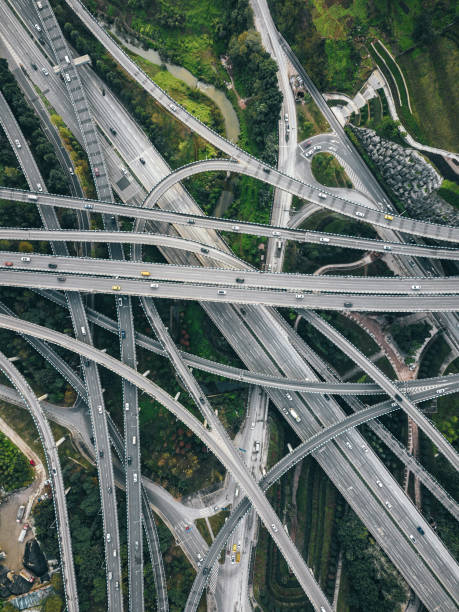 istock Aerial View of Complex Overpass and Busy Traffic 1304916720