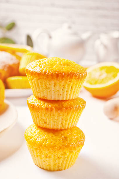 istock Homemade delicious lemon muffin cupcakes on the white table. Top view. 1304916909