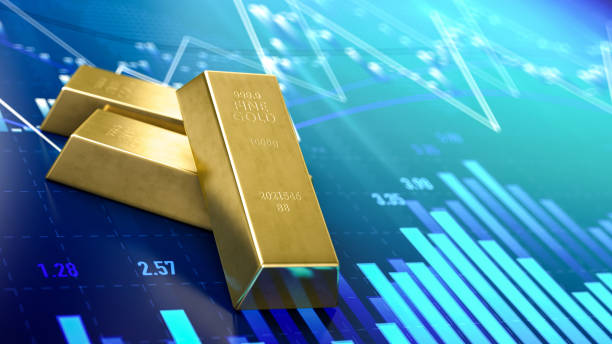 istock Gold Bars Sitting in Front of Bar Graph 1304917140