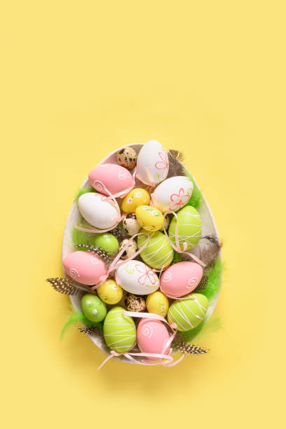 istock Colorful pastel easter eggs in plate as eggs. Easter greeting card. 1304918159