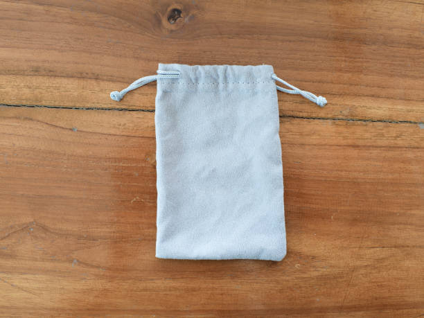 istock Gray cloth bag placed on the wooden floor 1304918224