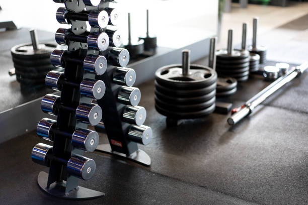 istock Dumbbells in a row at gym Dark toned 1304918365