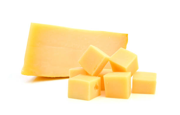 istock Cubes of cheddar cheese isolated on white 1304918533