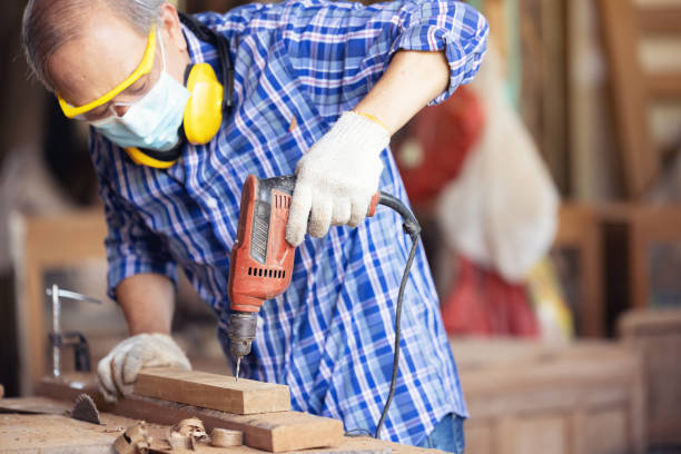 istock Carpenter, Senior man sanding wooden fence in workplace using work tool 1304920349