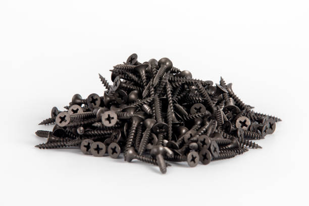 istock Black screws on a white background. Screws for plasterboard 1304922631