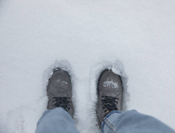 istock woman feet in snow 1304922914