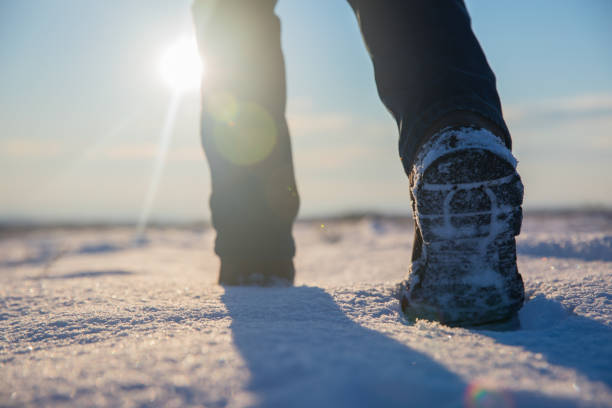 istock Man walk in the snow 1304922977