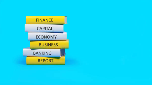 istock Yellow and white books listed under finance on blue background 1304926364