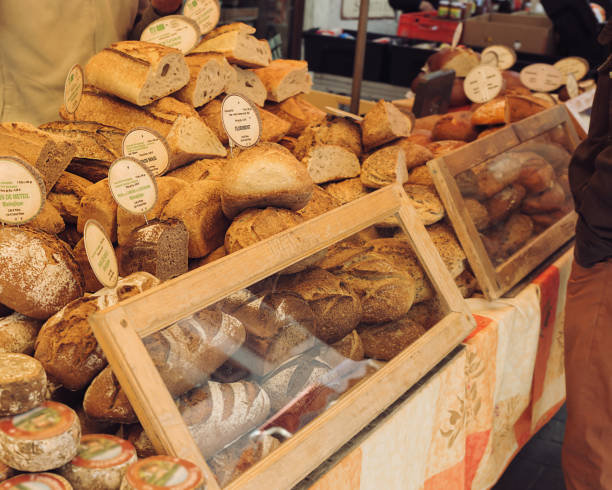 istock Open air market stand selling bread and cheese 1304926470