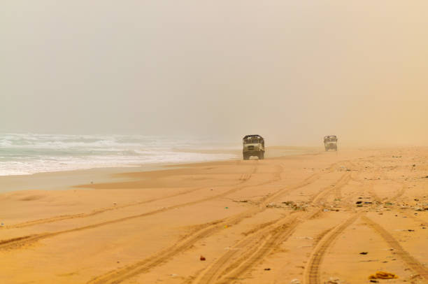 A 4WD tackling the sandy track around Indian Head on Fraser Island in Queensland.