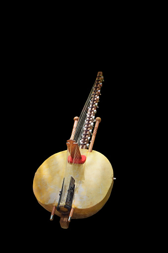 A uniquely west african musical instrument, the Kora is basically a calabash gourd with strings attached.  Here one is isolated on a black background  near Lake Retba, Pink Lack, in the Dakar region of Senegal