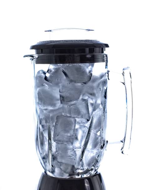 Illuminated ice in a glass jar blender