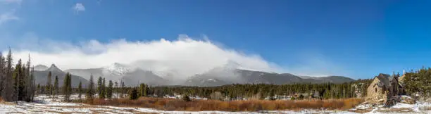 Panoramic view of the mountain range and Saint Catherine's Chapel on the Rock. Church in the Rocky Mountains. Allenspark, Colorado.