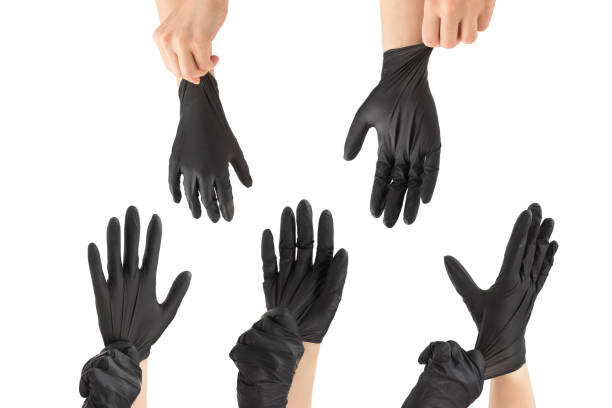 istock Woman puts on black rubber gloves. 1304932693