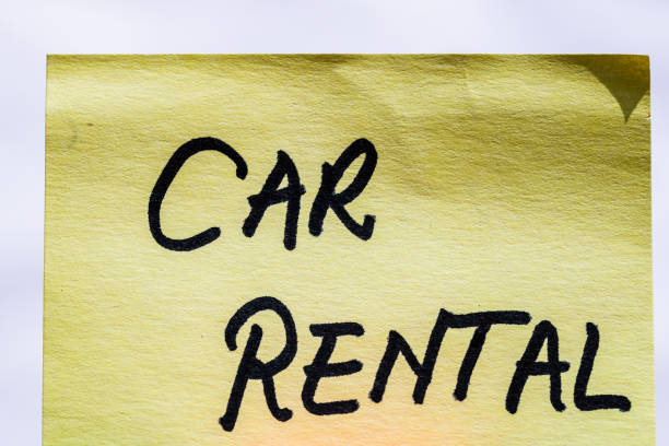 istock Rent car handwriting text close up isolated on yellow paper with copy space. 1304934318