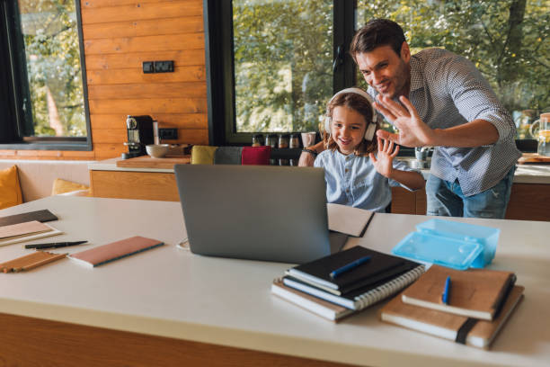 istock Little boy and his father using technology and having video call 1304934454