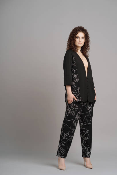 istock Curly woman portrait on gray background 1304935247