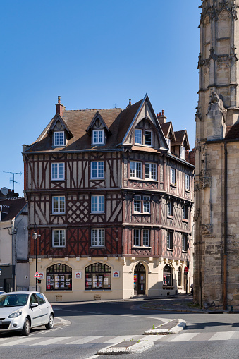 Compiègne, France - May 27 2020: Half-timbered townhouse opposite the Church of Saint-Antoine.