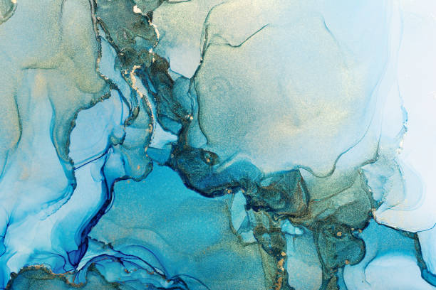 istock Blue and shiny golden alcohol ink abstract texture 1304935687